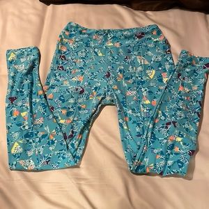 Lularoe One size leggings teal geometric shapes with white, yellow and peach